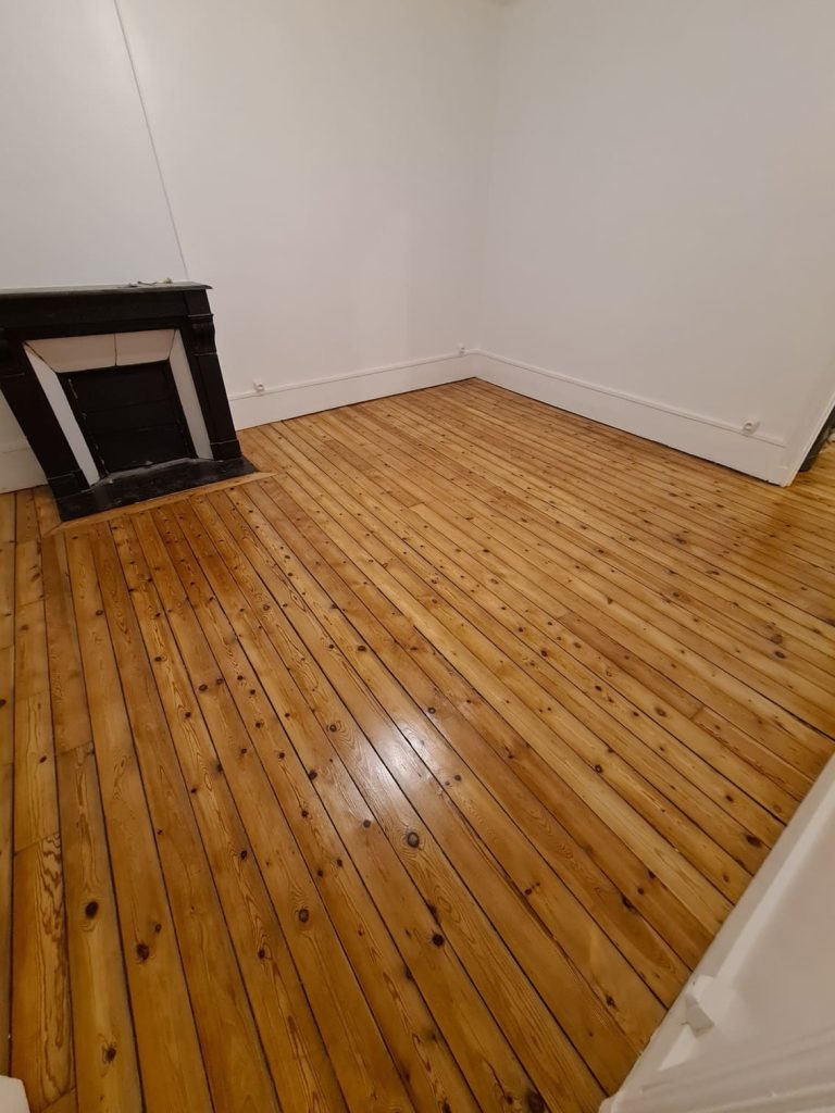 Pose parquet pièce de vie appartement à Asnières sur Seine